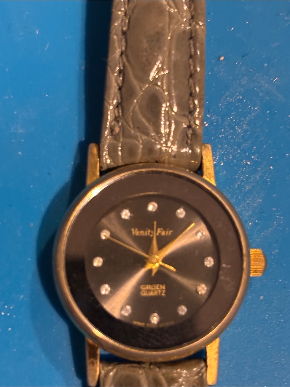 Vanity Fair Gold-Tone Case Black Dial Watch with Gray Strap